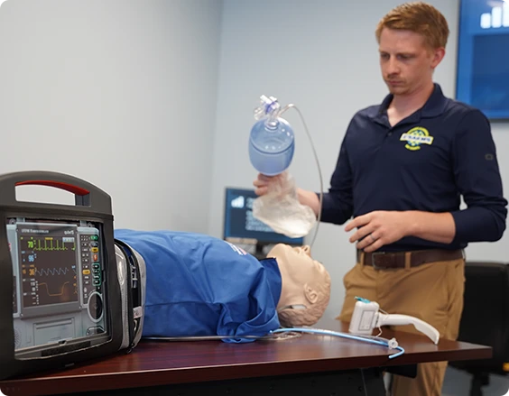 ems-class-trainpa EMS professionals treating a patient in the back of an ambulance