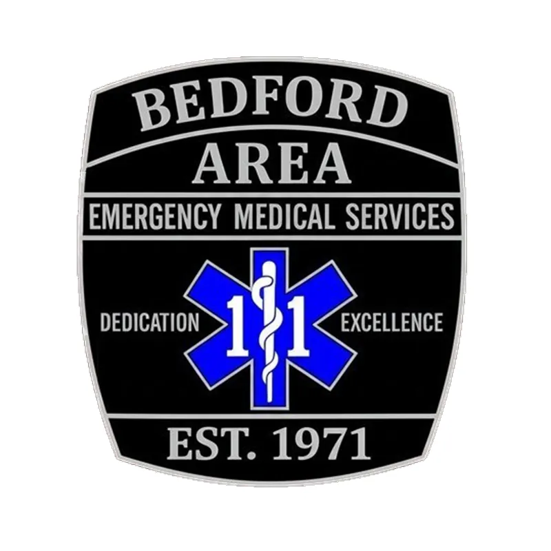 bedford-logo Ambulance vehicles in front of a garage